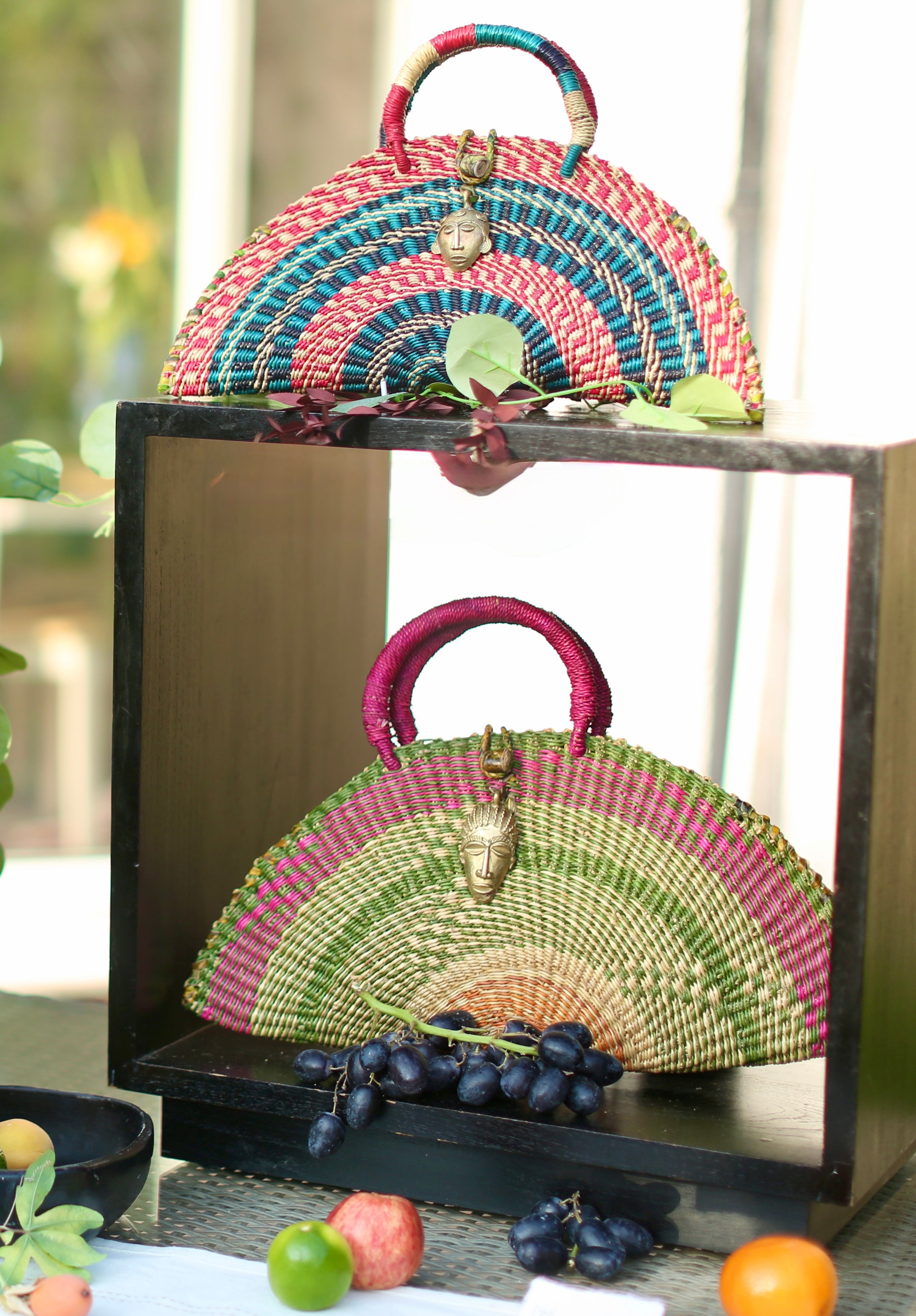 Handwoven Half-Moon Bag with Brass Mask Pendant